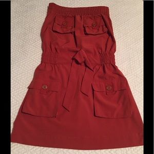 Rust colored strapless dress with gold buttons